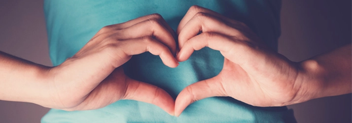 Acupuncture Flower Mound TX Heart Hands A person making a heart shape with their hands.