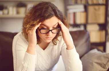 A person holding their head.